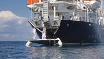 Sailing yacht RUNNING ON WAVES -  Stern